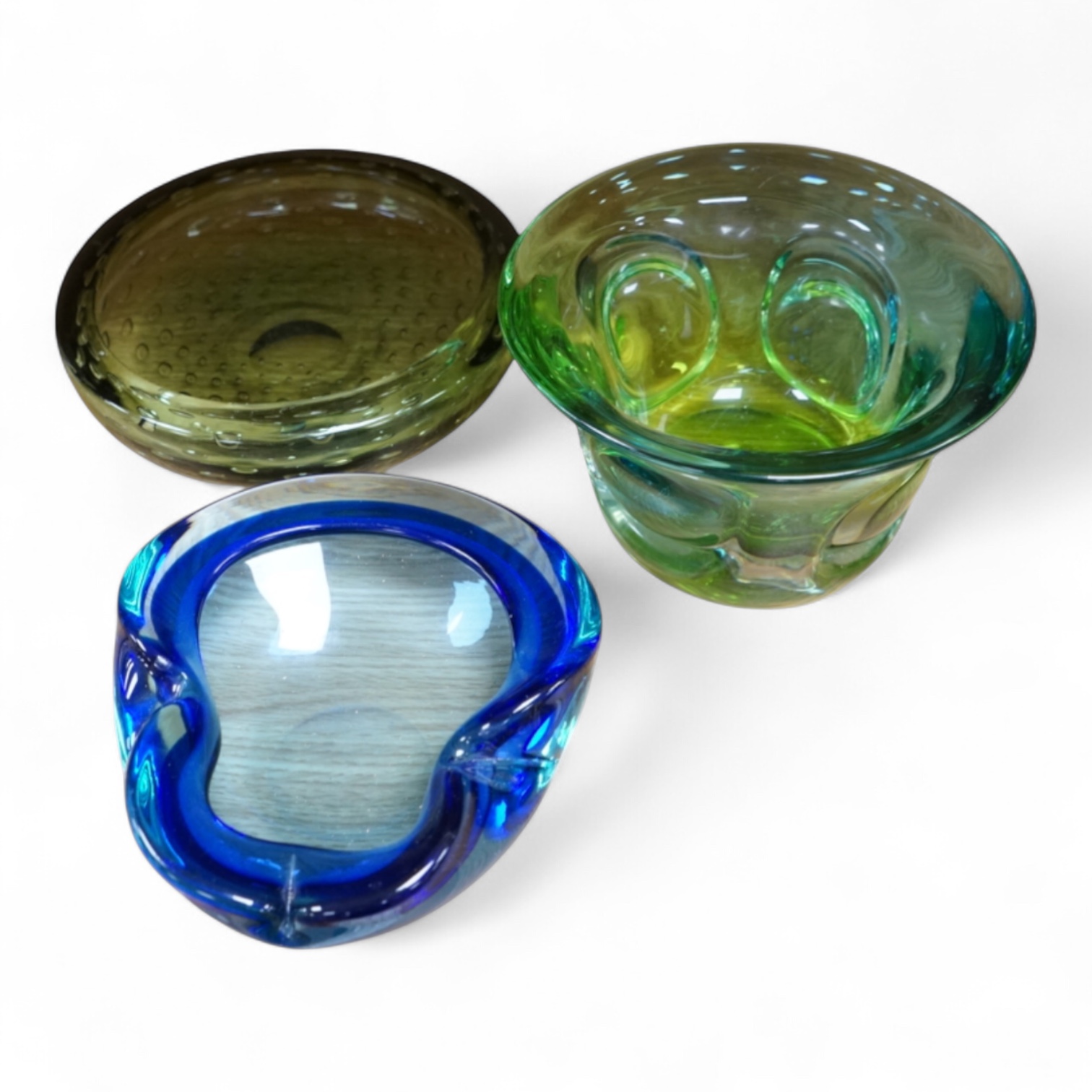 A Whitefriars green glass ‘bubble’ dish, a Costa Boda blue/green bowl and a Murano dish (3) tallest 10.5cm